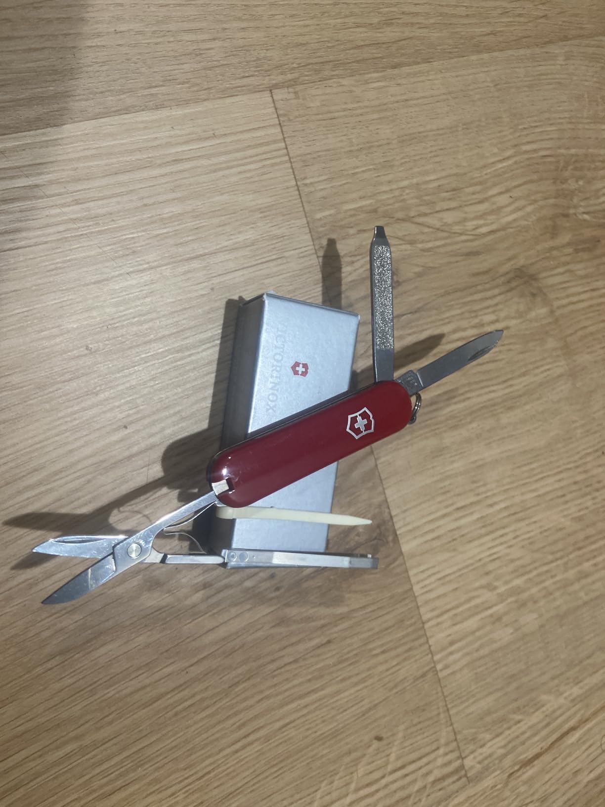 Victorinox Classic SD Swiss Army Knife, Compact, 7 Functions, Swiss Made Pocket Knife with Small Blade, Screwdriver and Key Ring - Style Icon (Red) | Swiss made compact multi-tool with scissors, nail file, tweezers, and toothpick. Durable iconic stainless steel construction customer photo 2