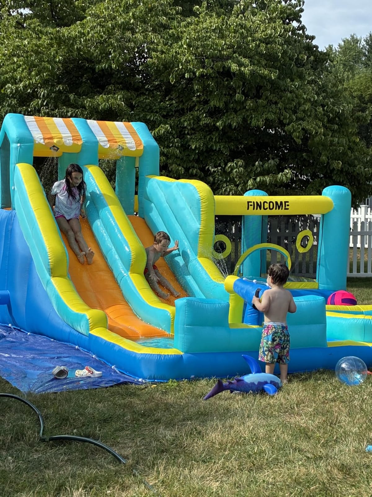 FINCOME Inflatable Bounce House, 10 in 1 Double Water Slide Bounce House with 750W Blower, Climbing Wall, Jumping, Water Gun, Splash Pool, Basketball Hoop for Kids Indoor Outdoor Backyard customer photo 2