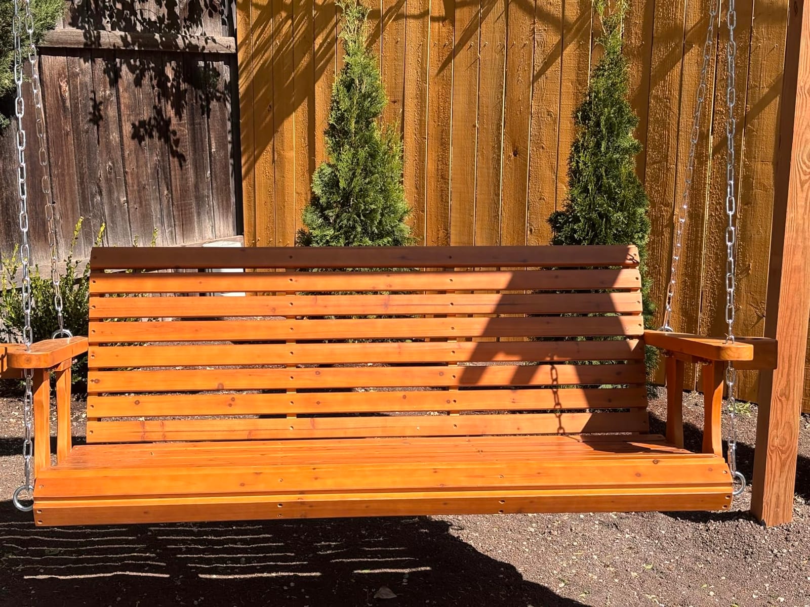 Fortune Candy Wooden Porch Swing 2-Seater, Cedar Tone, 4 FT Extra Large | Weather Resistant, High Backrest and Deep Seat, Cupholders, Hanging Chains and 7mm Springs, Heavy Duty 880 LBS customer photo 1